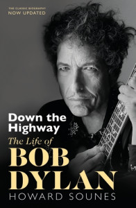 cover, Down The Highway, an elderly Bob Dylan in closeup, his hands on the fretboard of a guitar